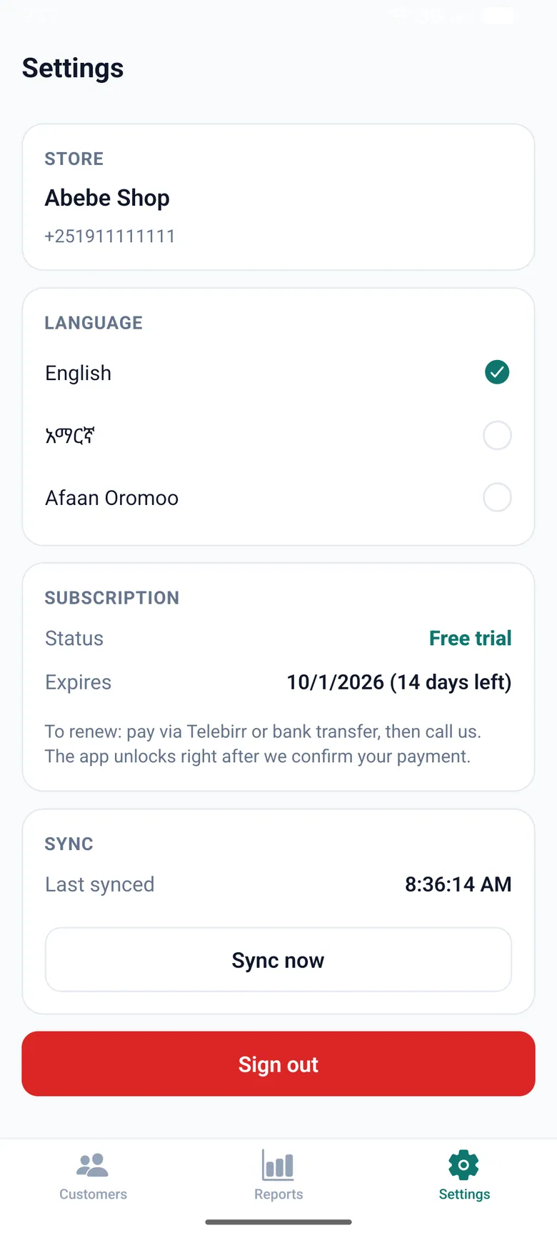 Dube settings screen with the store name, a language picker for English, Amharic and Afaan Oromoo, and a free trial subscription expiring in 14 days