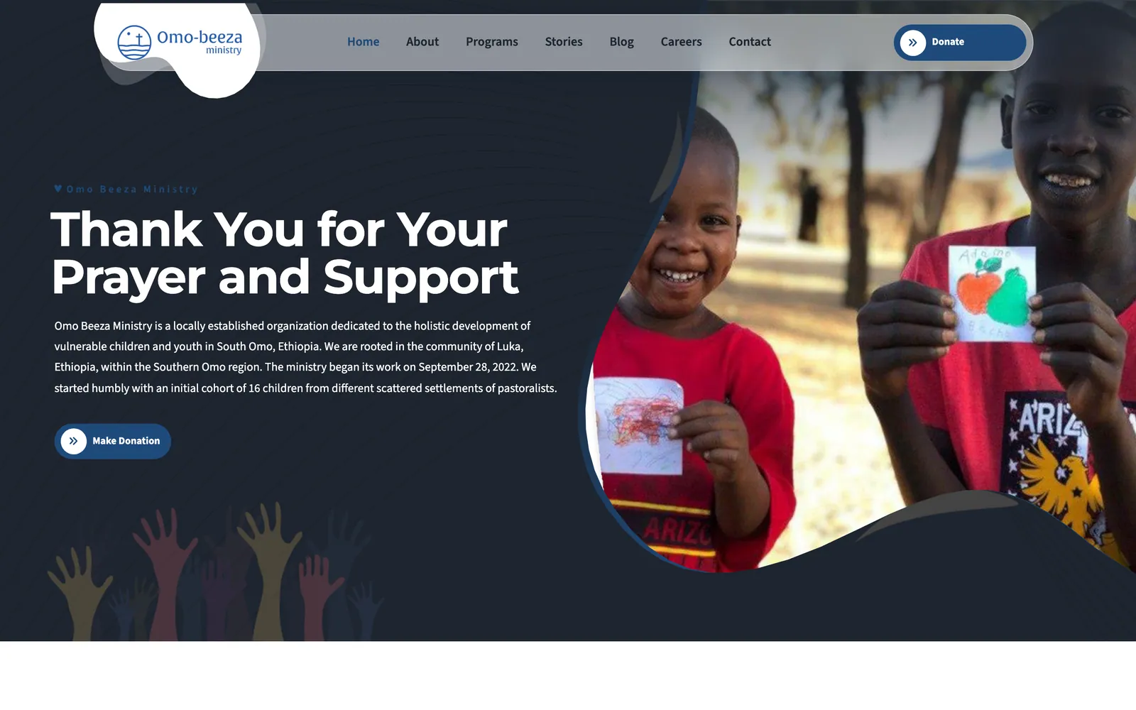 Omo Beeza Ministry English home page with the headline Thank You for Your Prayer and Support beside a photo of two children holding drawings